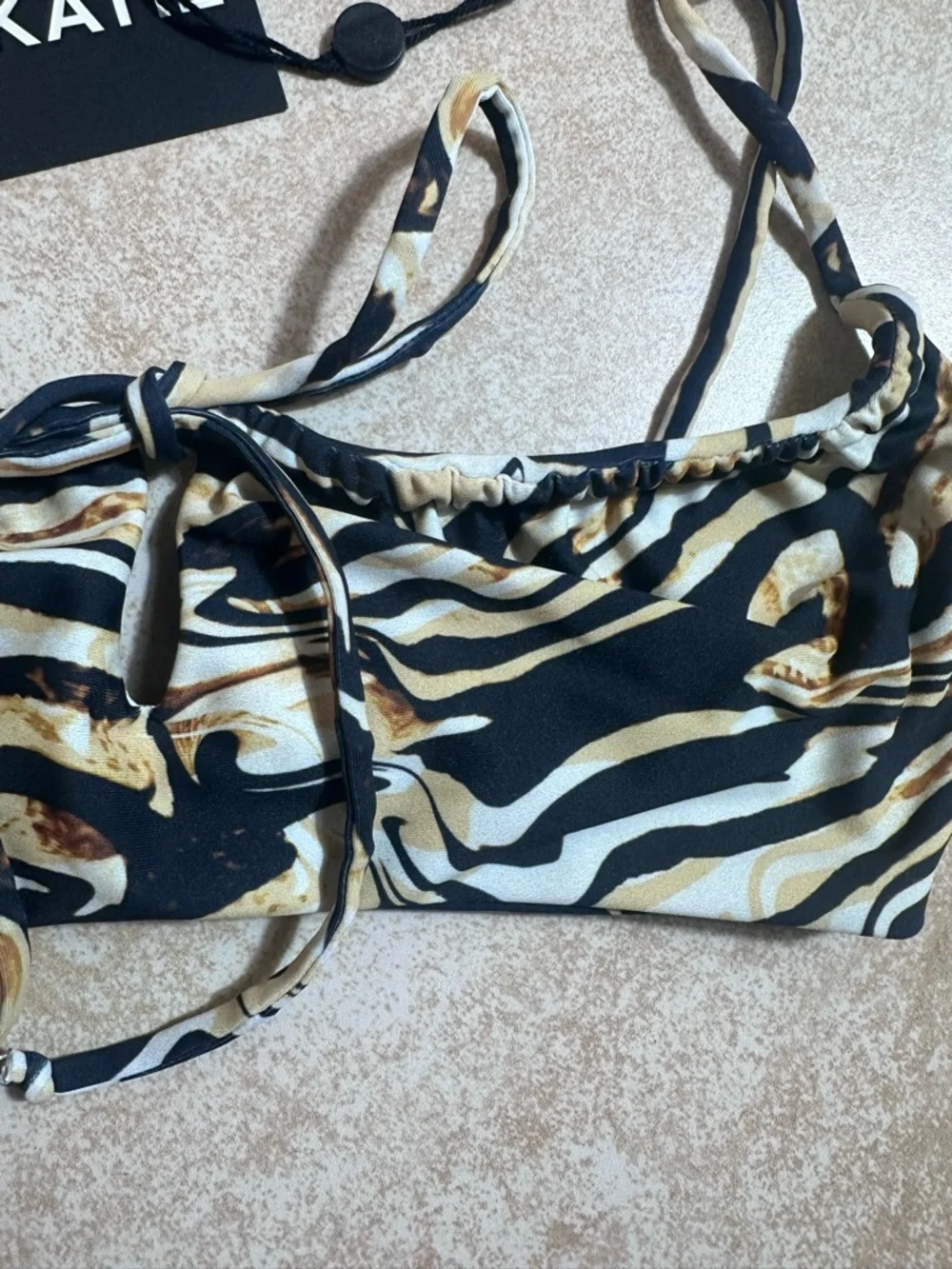 Skatie Swirl-Print Bikini Top in Black, Cream, and Brown
